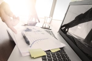 Close up of business man hand working on laptop computer with social media diagram and chart graph on wooden desk as concept Close up of business man hand working on laptop computer with social media diagram and chart graph on wooden desk as concept